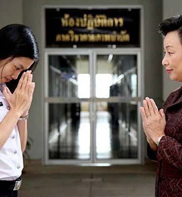 Lao women greeting each other